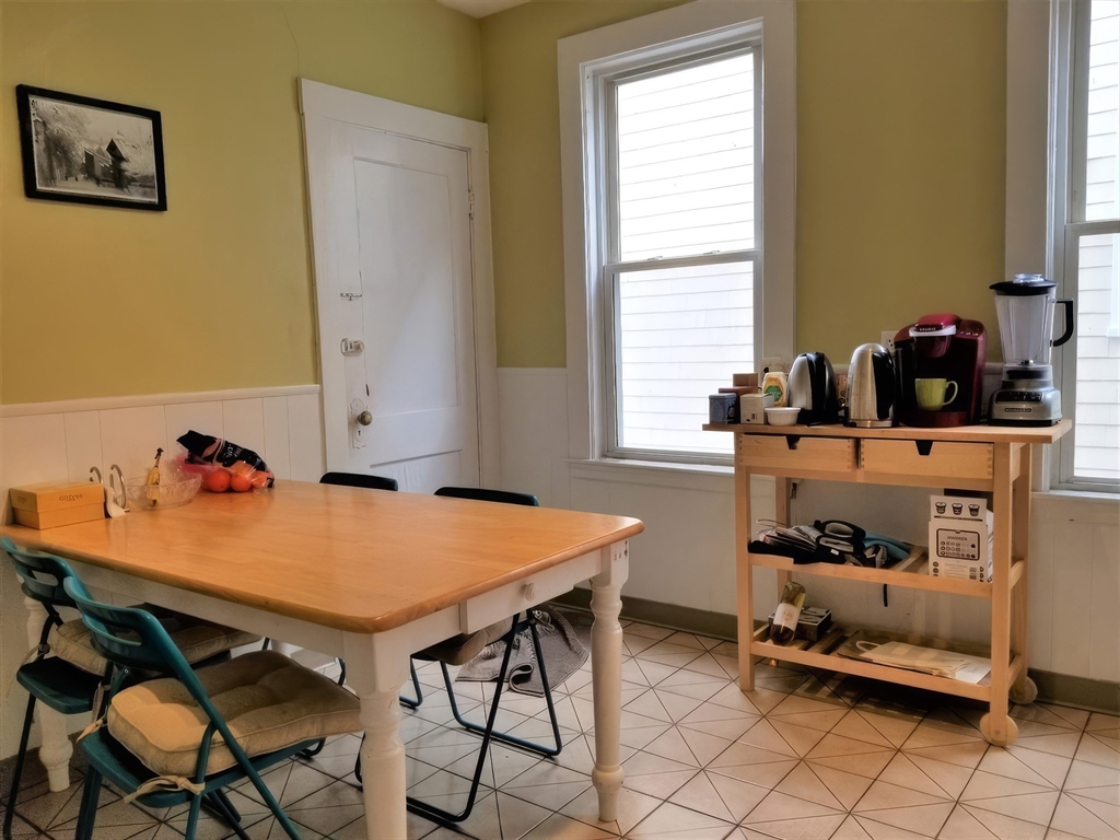 119 Browne Street, Unit 1 Brookline, MA 02446 - Photo 12 of 15 a workspace with furniture and window