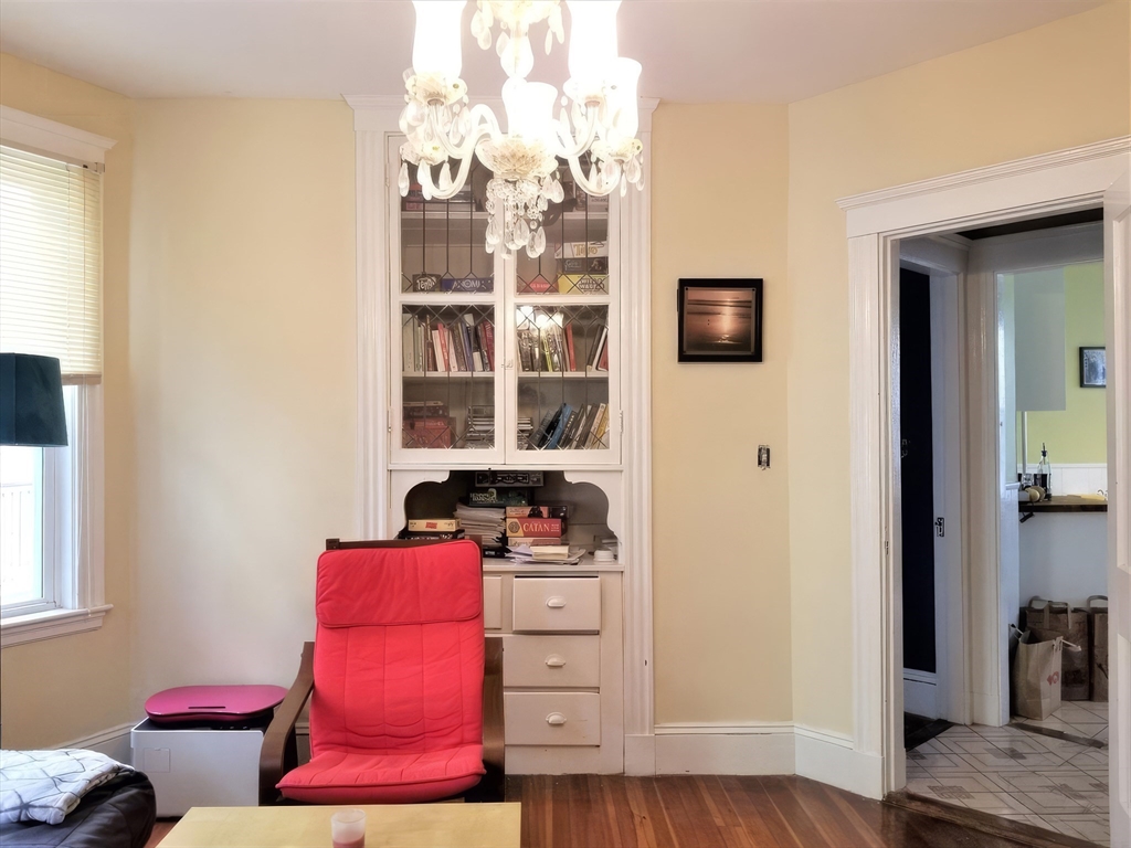 119 Browne Street, Unit 1 Brookline, MA 02446 - Photo 6 of 15 a view of walk in closet with clothes and shoes