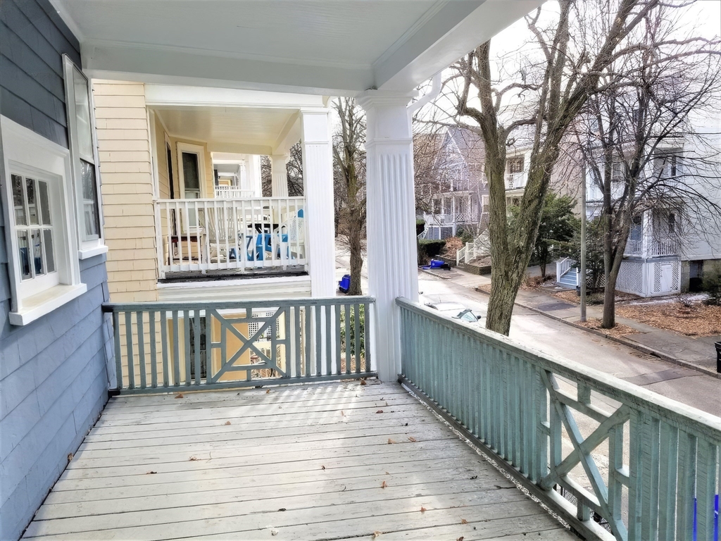 119 Browne Street, Unit 1 Brookline, MA 02446 - Photo 7 of 15 a view of a house with wooden deck