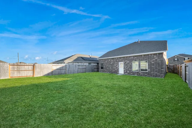 a view of a house with a big yard