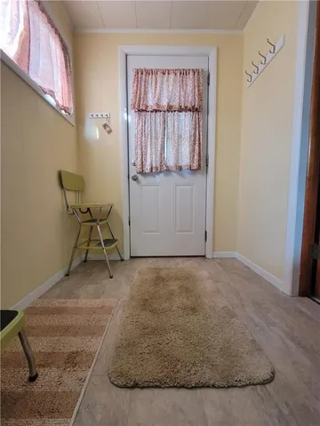 a view of a livingroom with furniture and cabinet