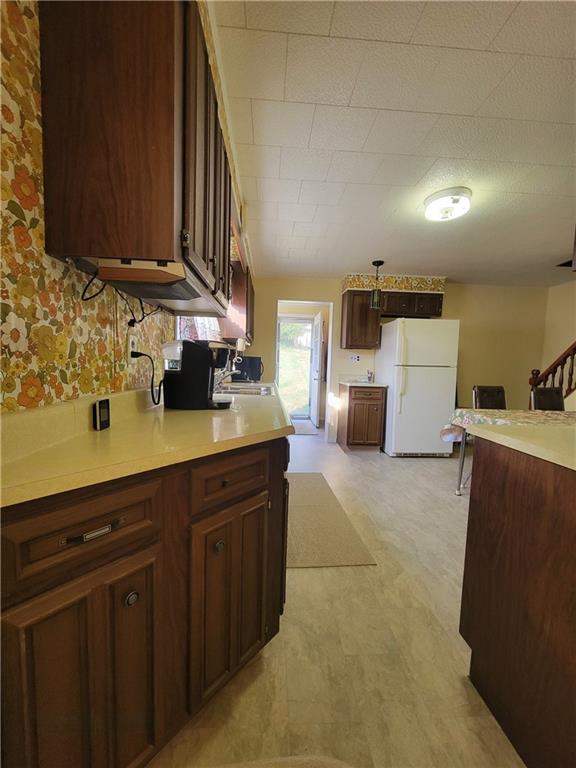 141 Grant Street Star Junction, PA 15482 - Photo 4 of 22 a kitchen with stainless steel appliances a sink cabinets and wooden floor
