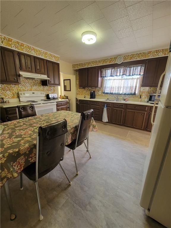141 Grant Street Star Junction, PA 15482 - Photo 6 of 22 a kitchen with stainless steel appliances kitchen island granite countertop a sink and cabinets
