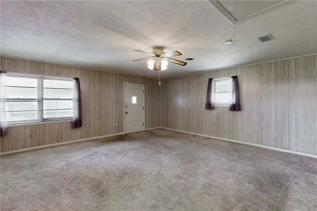 a view of storage and utility room with racks on the wall