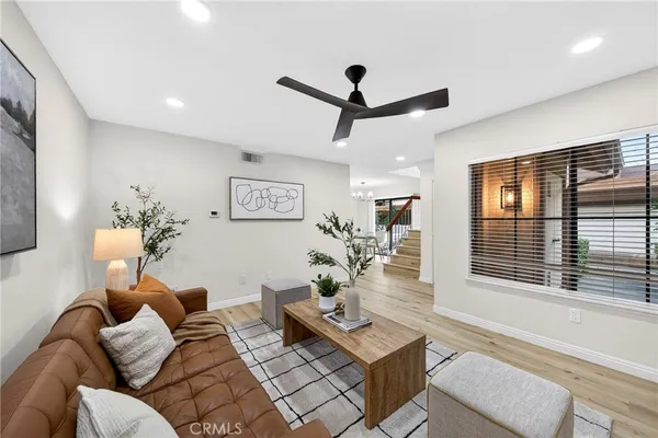 a living room with furniture and a window