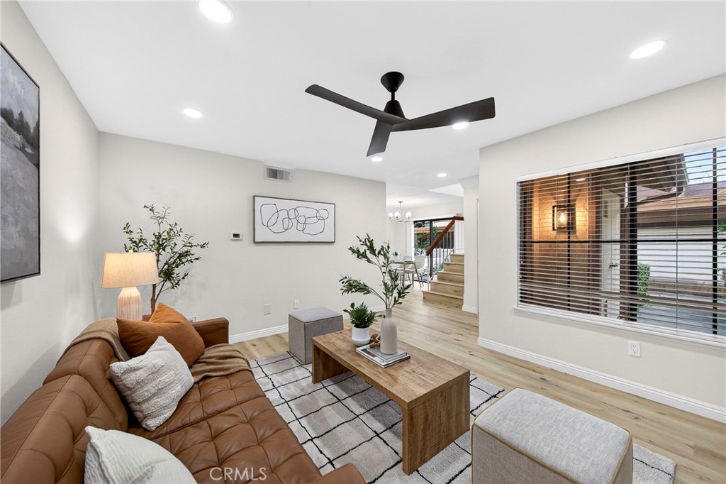 3054 Colt Way, Unit 209 Fullerton, CA 92833 - Photo 1 of 1 a living room with furniture and a window