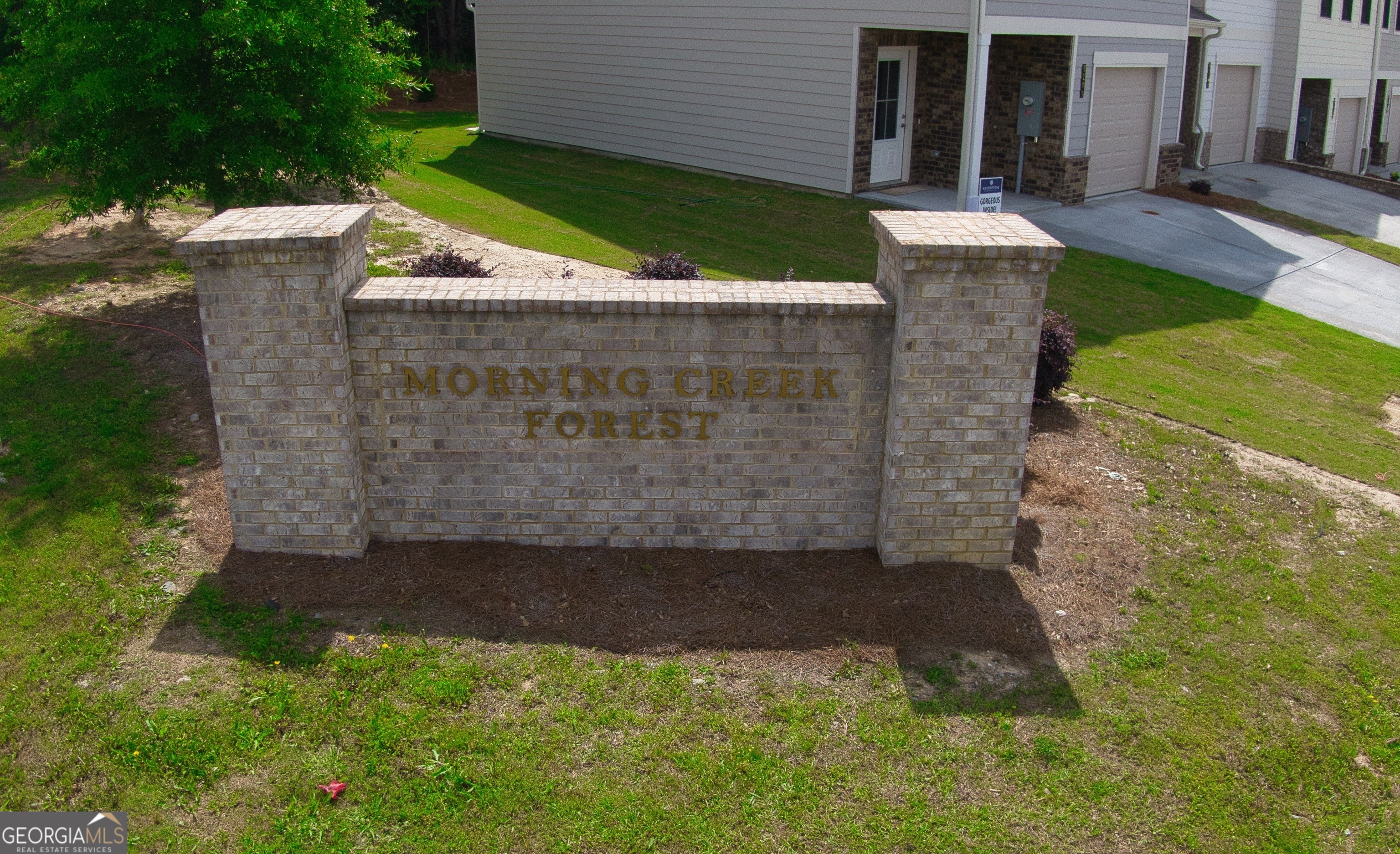 3405 Ripple Loop, Unit 127 Atlanta, GA 30349 - Photo 4 of 26 front view of a house with a yard