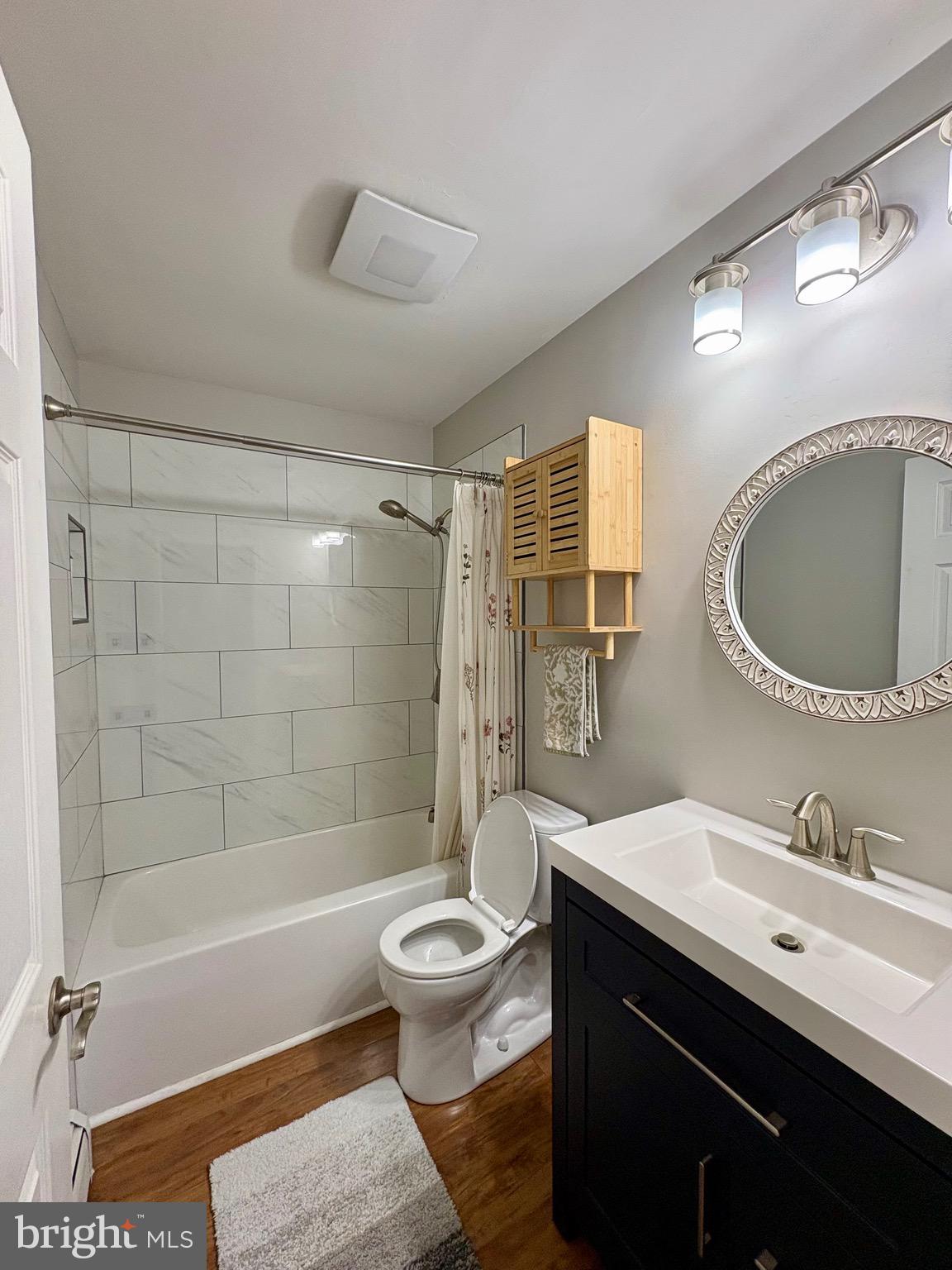 1288 Copeland School Road West Chester, PA 19380 - Photo 23 of 36 a bathroom with a sink a toilet a mirror and bathtub