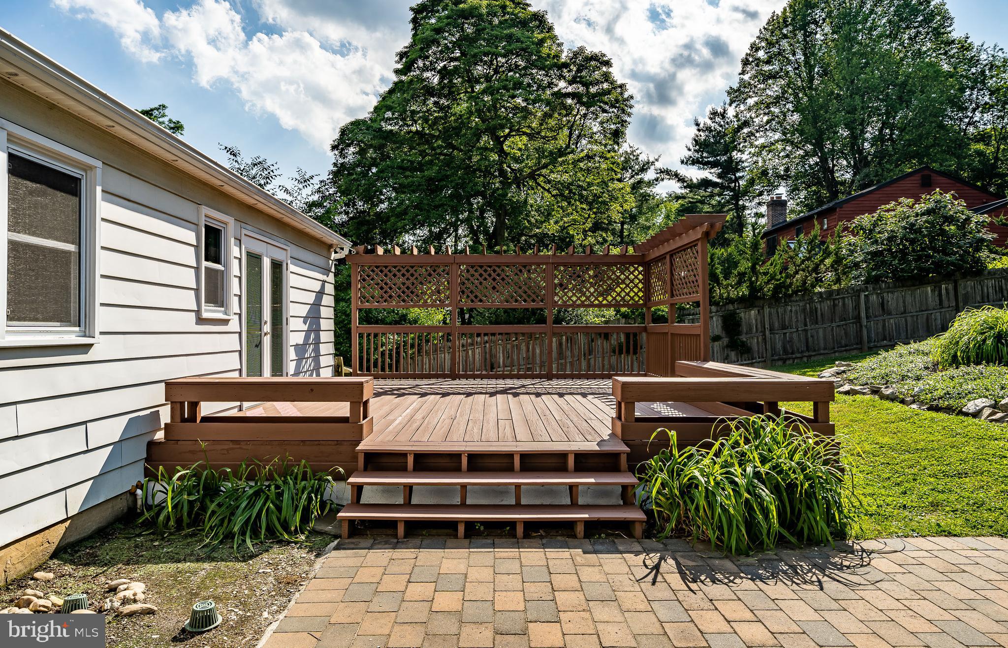 1288 Copeland School Road West Chester, PA 19380 - Photo 35 of 36 a view of a patio with table and chairs potted plants and large tree