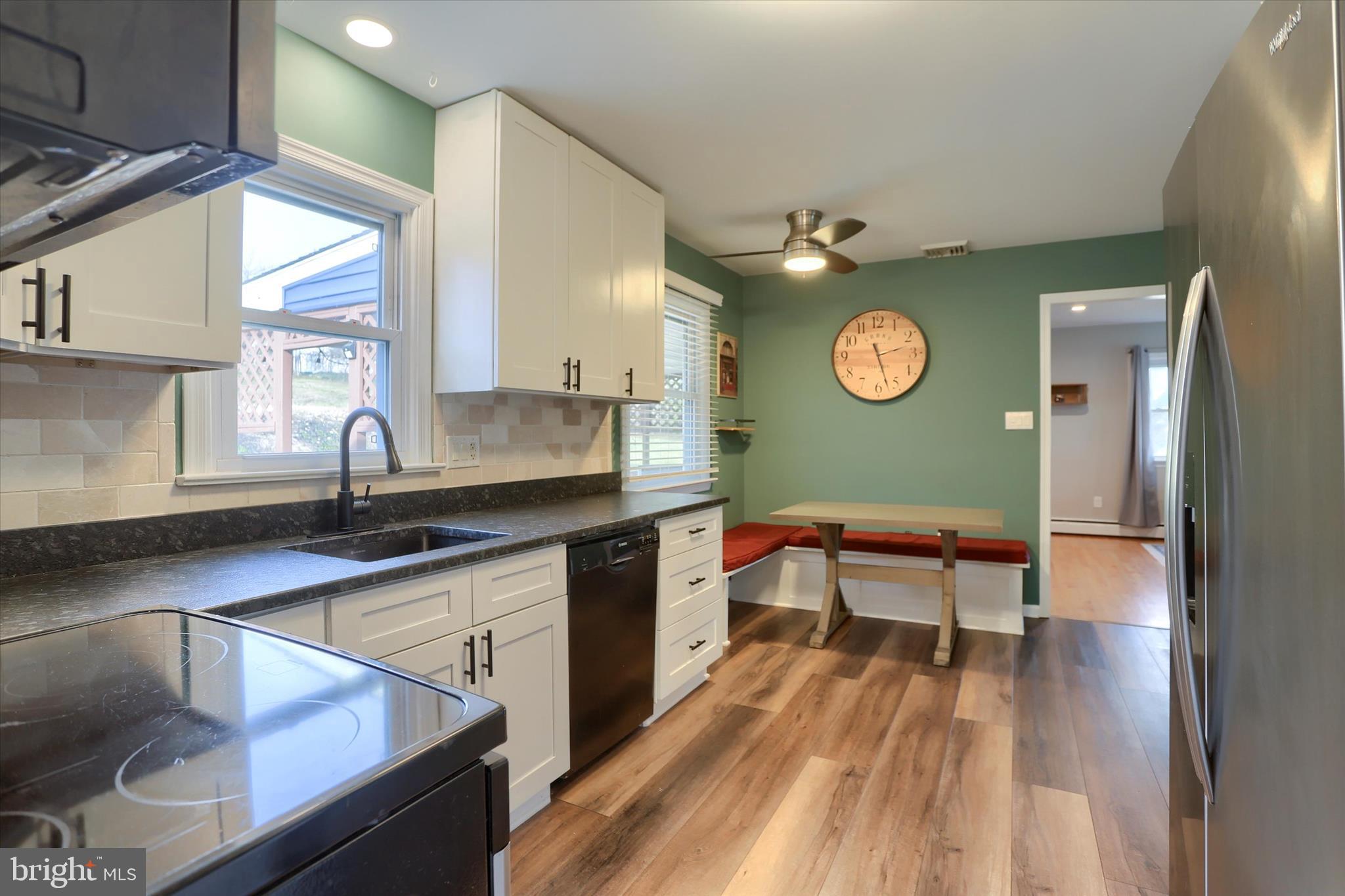 1288 Copeland School Road West Chester, PA 19380 - Photo 7 of 36 a kitchen with stainless steel appliances granite countertop a sink and a refrigerator