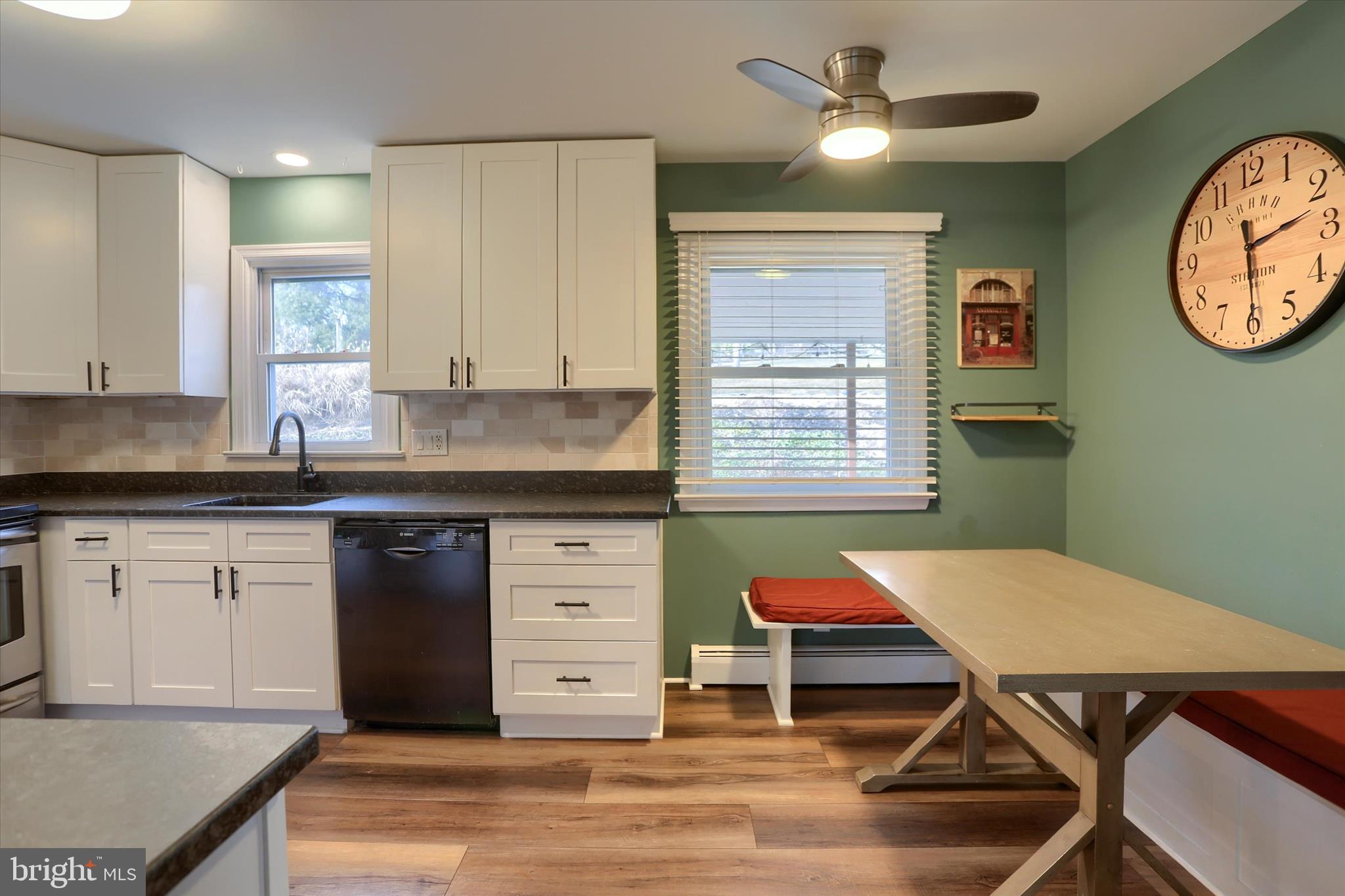 1288 Copeland School Road West Chester, PA 19380 - Photo 9 of 36 a kitchen with a dining table chairs and cabinets
