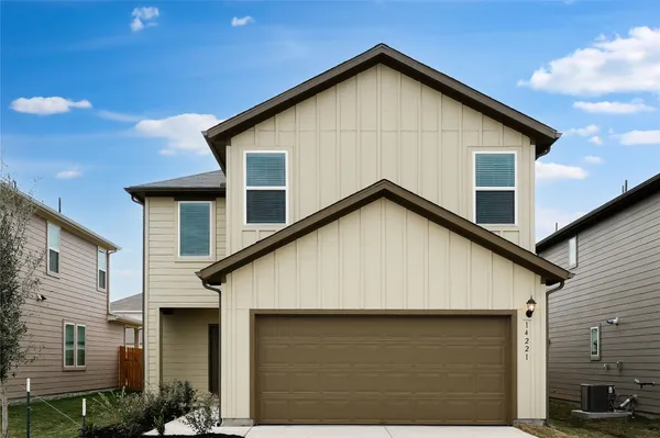 a front view of a house with garage