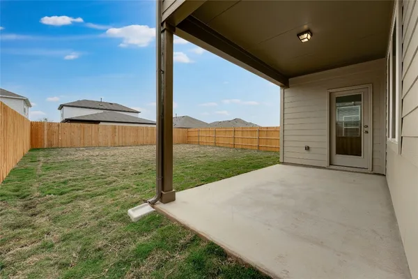 a view of a backyard of the house