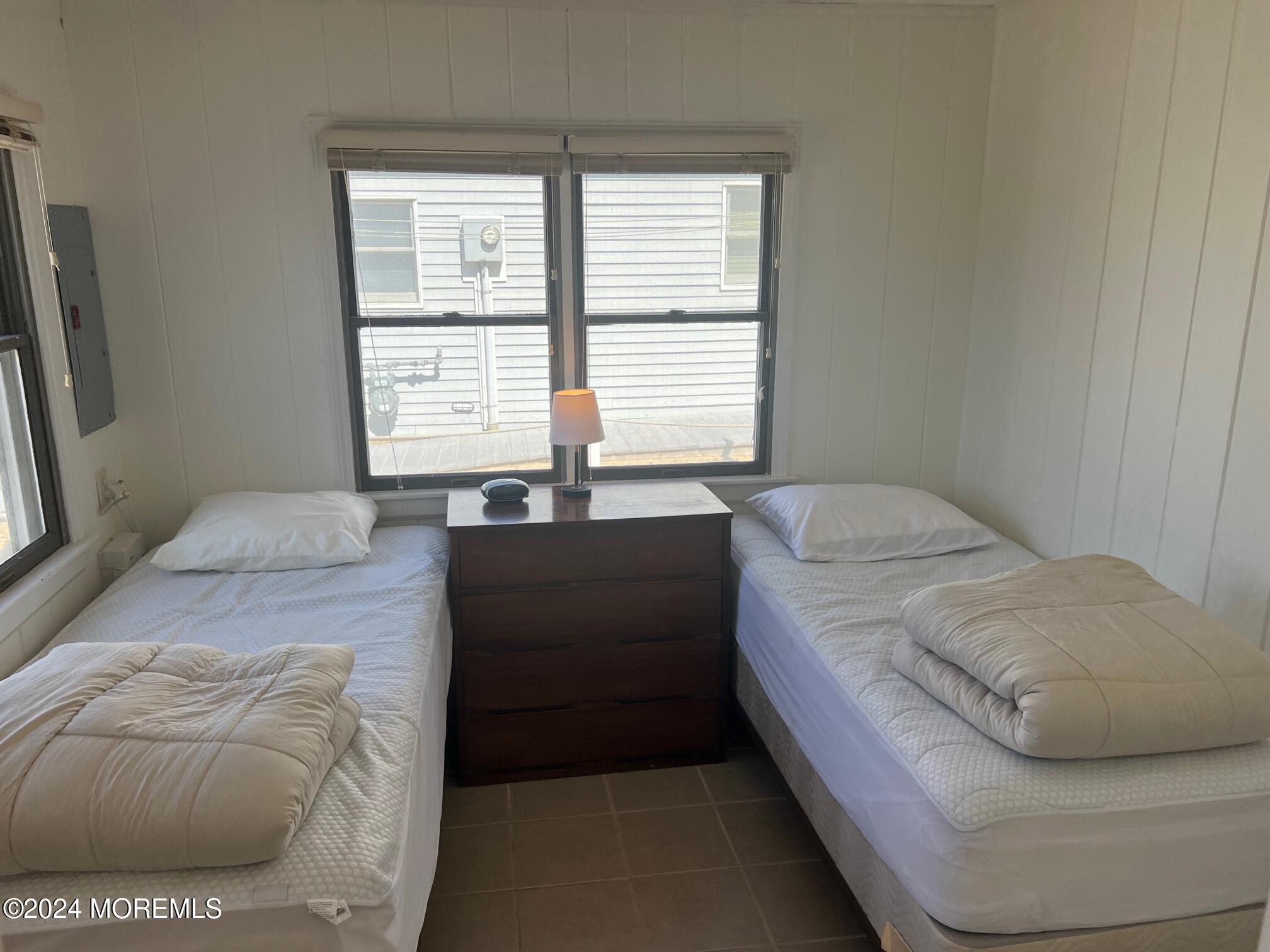 3164 Ocean Road Lavallette, NJ 08735 - Photo 11 of 14 a bedroom with a bed and a couch