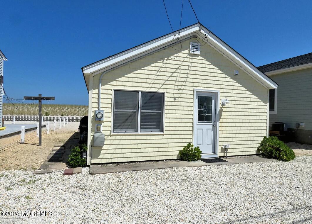 3164 Ocean Road Lavallette, NJ 08735 - Photo 2 of 14 a front view of a house with a yard