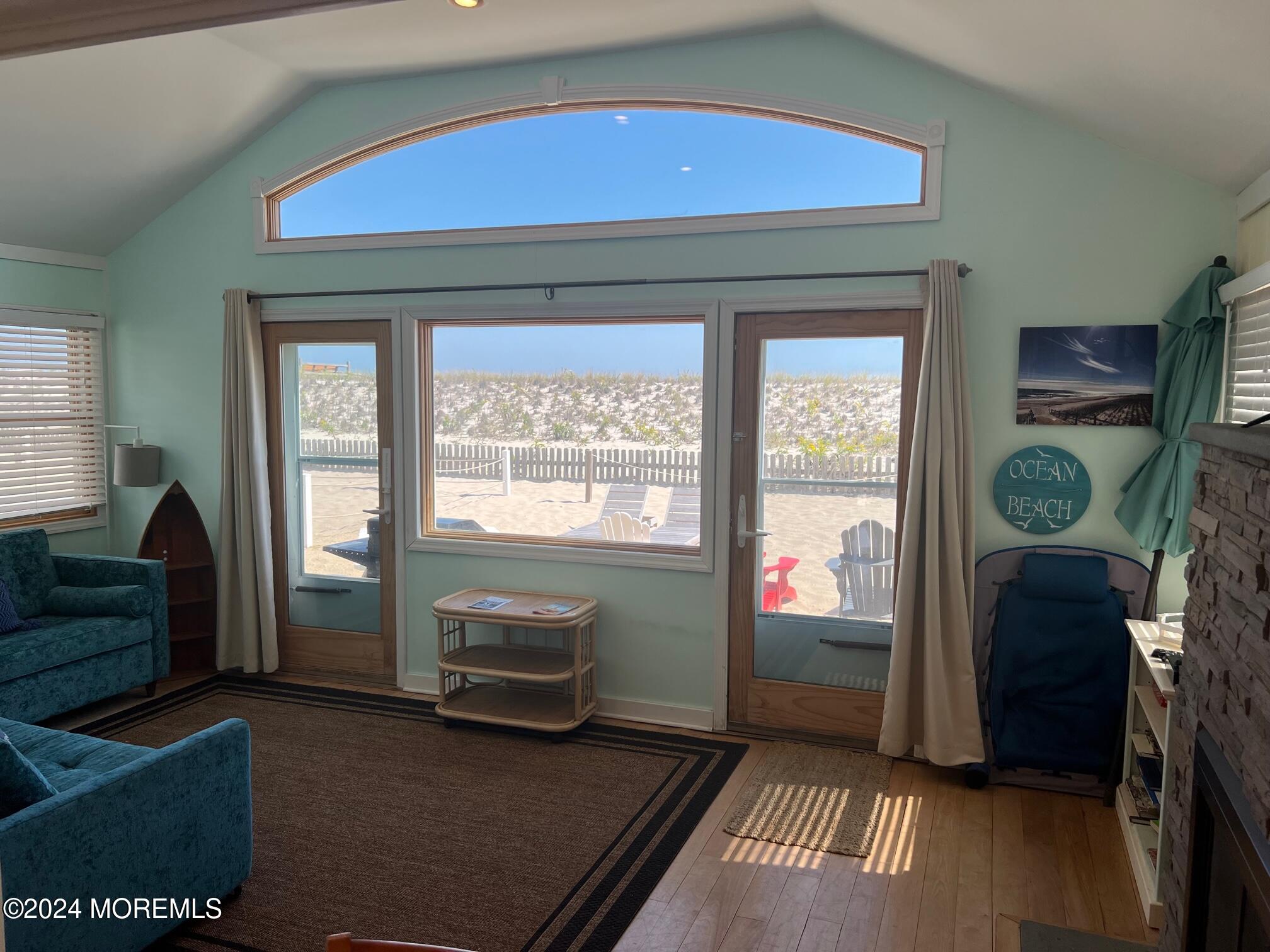 3164 Ocean Road Lavallette, NJ 08735 - Photo 9 of 14 a living room with furniture and a floor to ceiling window