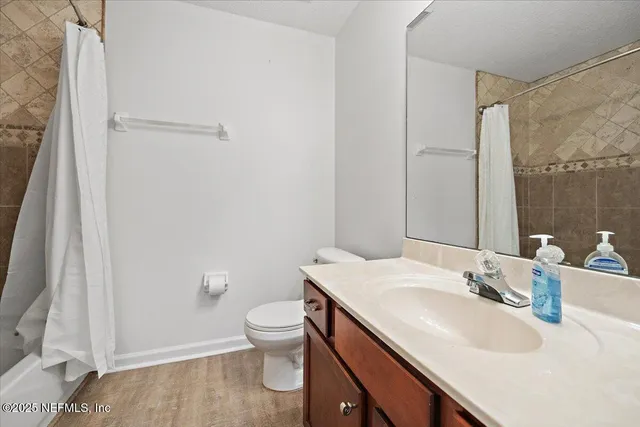 a bathroom with a sink toilet and vanity