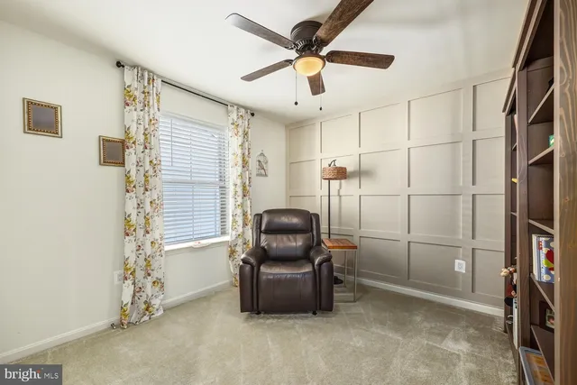 a view of a livingroom with a couch and a window