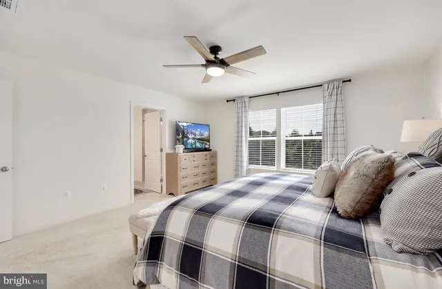 a bathroom with a toilet a sink and a mirror