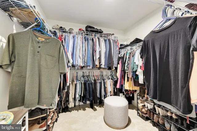 a living room with furniture and a table with wooden floor