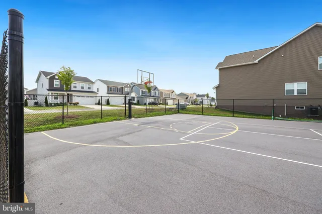 a front view of a house with a garden and plants