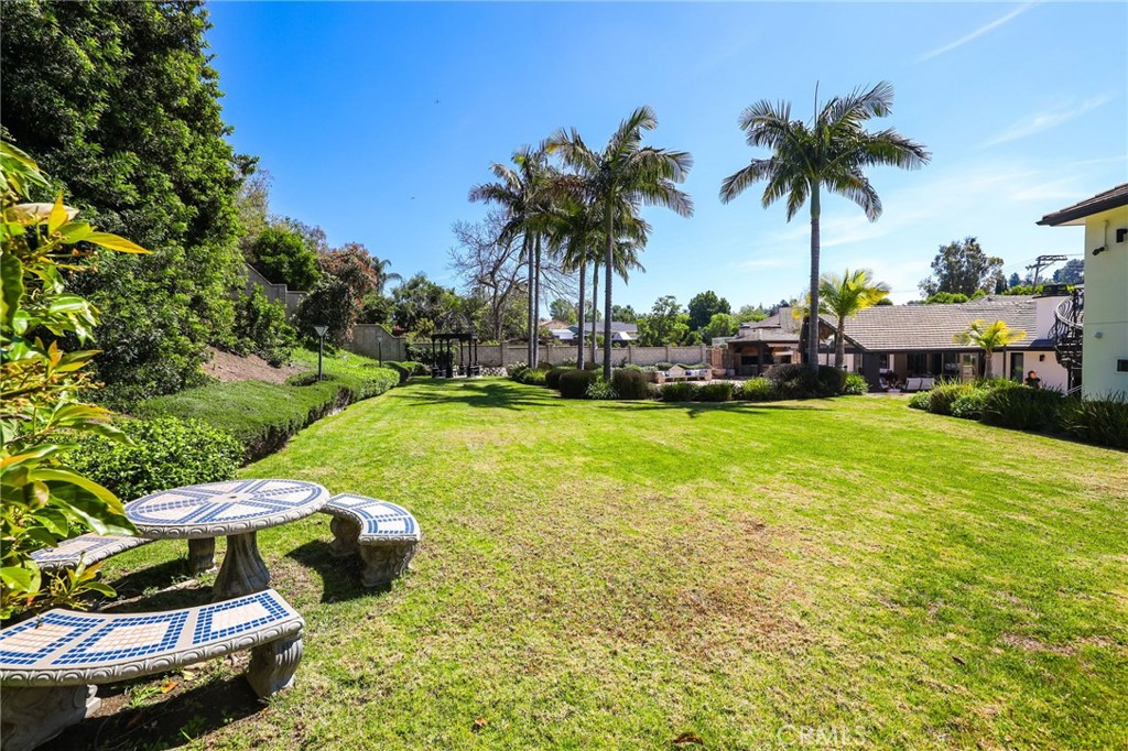 10372 South Crawford Canyon Road Santa Ana, CA 92705 - Photo 11 of 75 a view of a swimming pool and lounge chairs