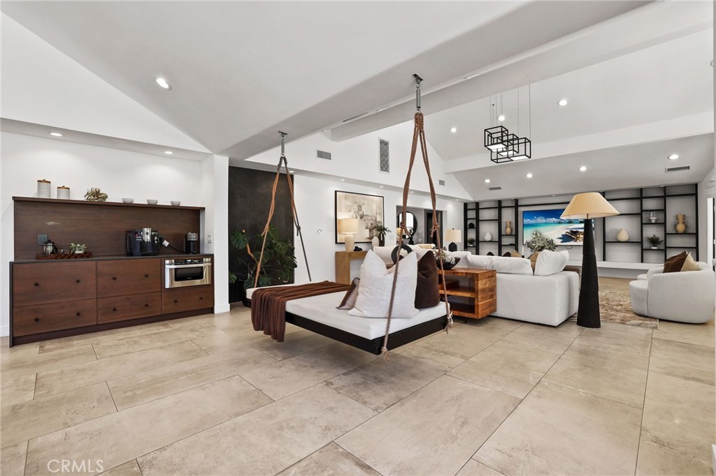 10372 South Crawford Canyon Road Santa Ana, CA 92705 - Photo 30 of 75 a living room with furniture and a flat screen tv