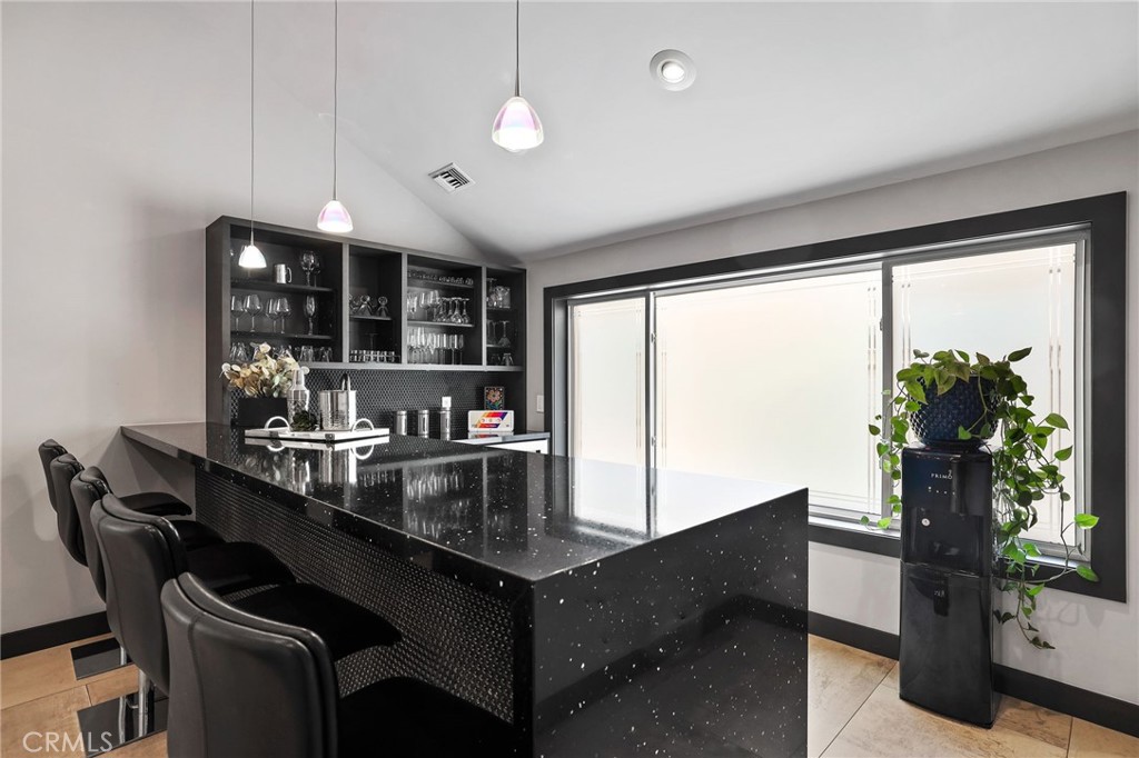 10372 South Crawford Canyon Road Santa Ana, CA 92705 - Photo 36 of 75 a kitchen with a counter space a sink appliances and a large window