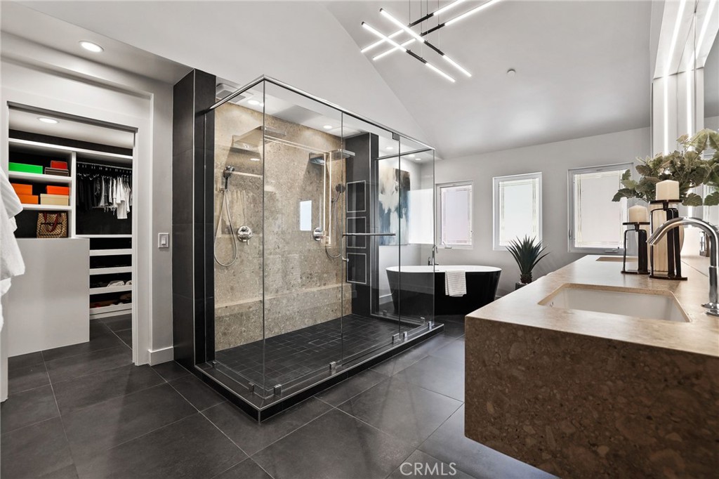 10372 South Crawford Canyon Road Santa Ana, CA 92705 - Photo 41 of 75 a spacious bathroom with a double vanity sink a mirror and a shower