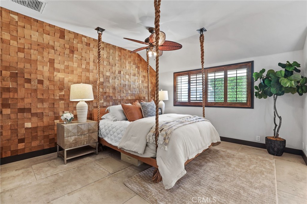 10372 South Crawford Canyon Road Santa Ana, CA 92705 - Photo 47 of 75 a bed room with a bed and a couch