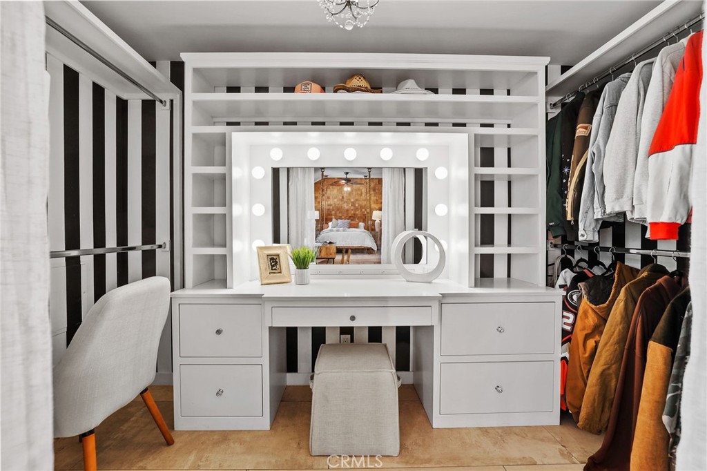 10372 South Crawford Canyon Road Santa Ana, CA 92705 - Photo 50 of 75 a view of cabinets a flat screen tv and a stove