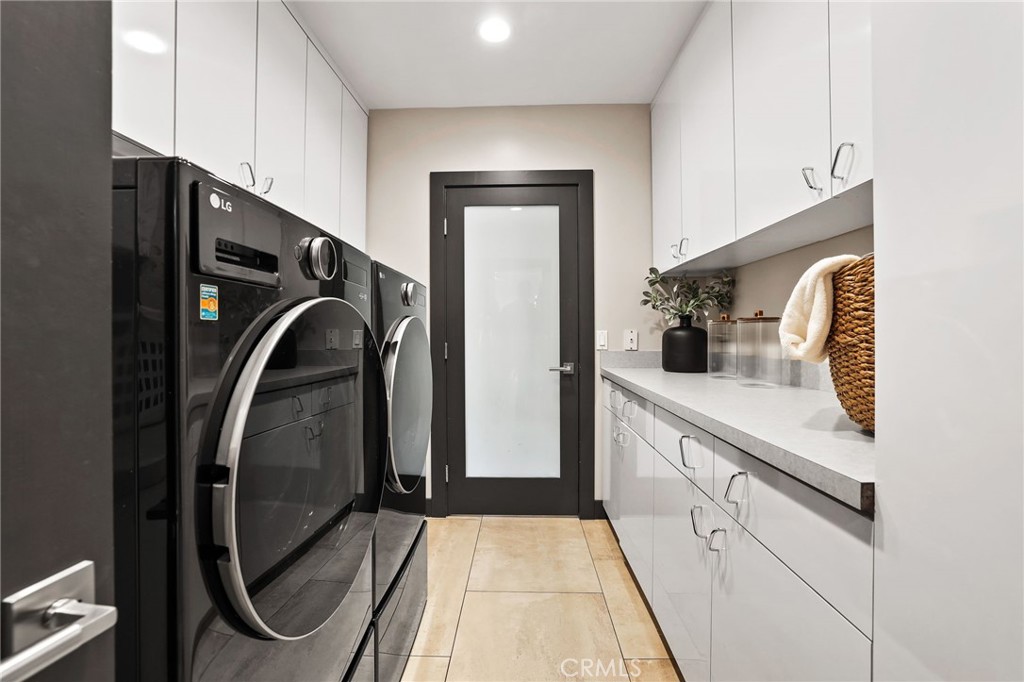 10372 South Crawford Canyon Road Santa Ana, CA 92705 - Photo 58 of 75 a kitchen with a refrigerator and washer