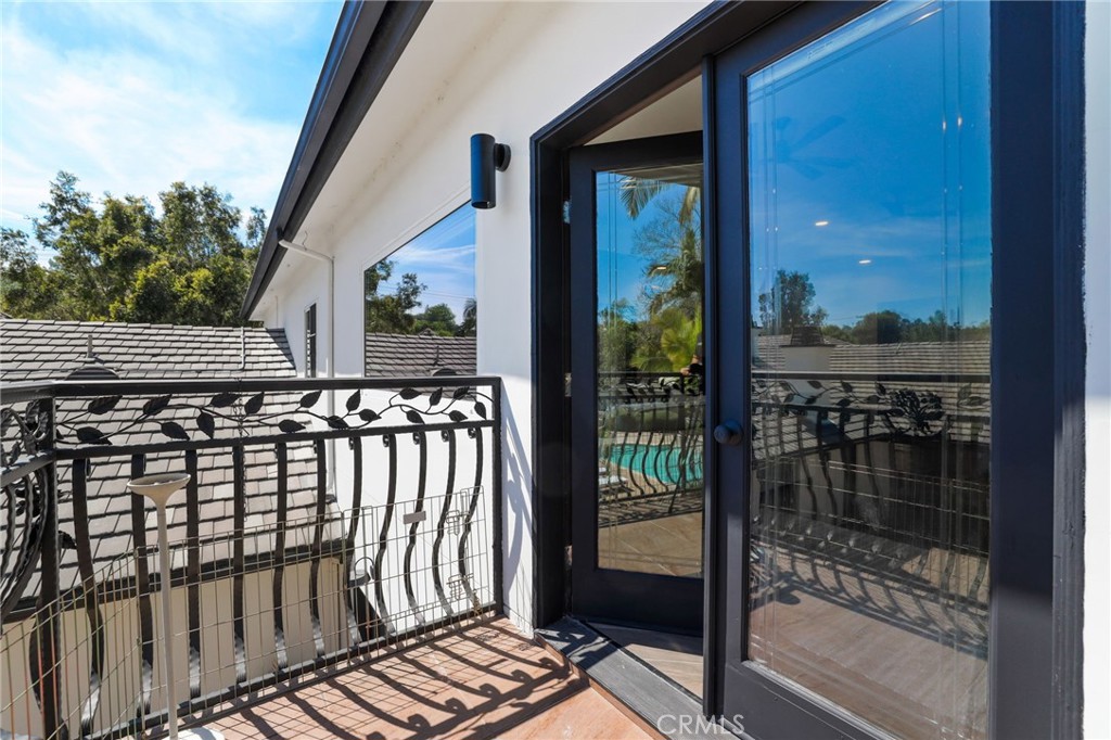 10372 South Crawford Canyon Road Santa Ana, CA 92705 - Photo 63 of 75 a view of a balcony with a potted plant