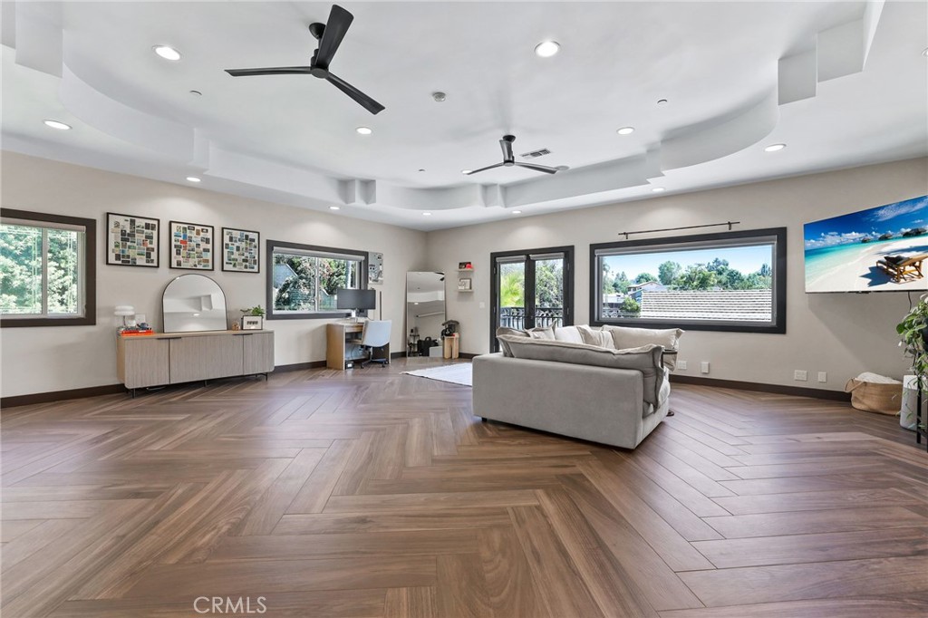 10372 South Crawford Canyon Road Santa Ana, CA 92705 - Photo 65 of 75 a living room with furniture and wooden floor