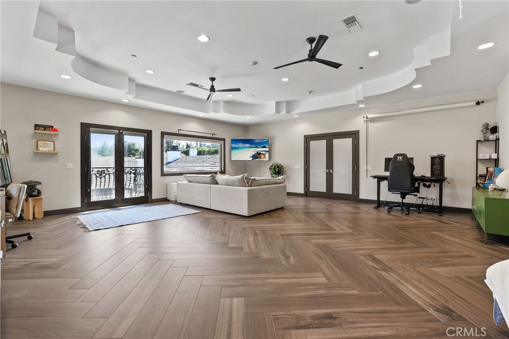 10372 South Crawford Canyon Road Santa Ana, CA 92705 - Photo 66 of 75 a living room with furniture and a wooden floor