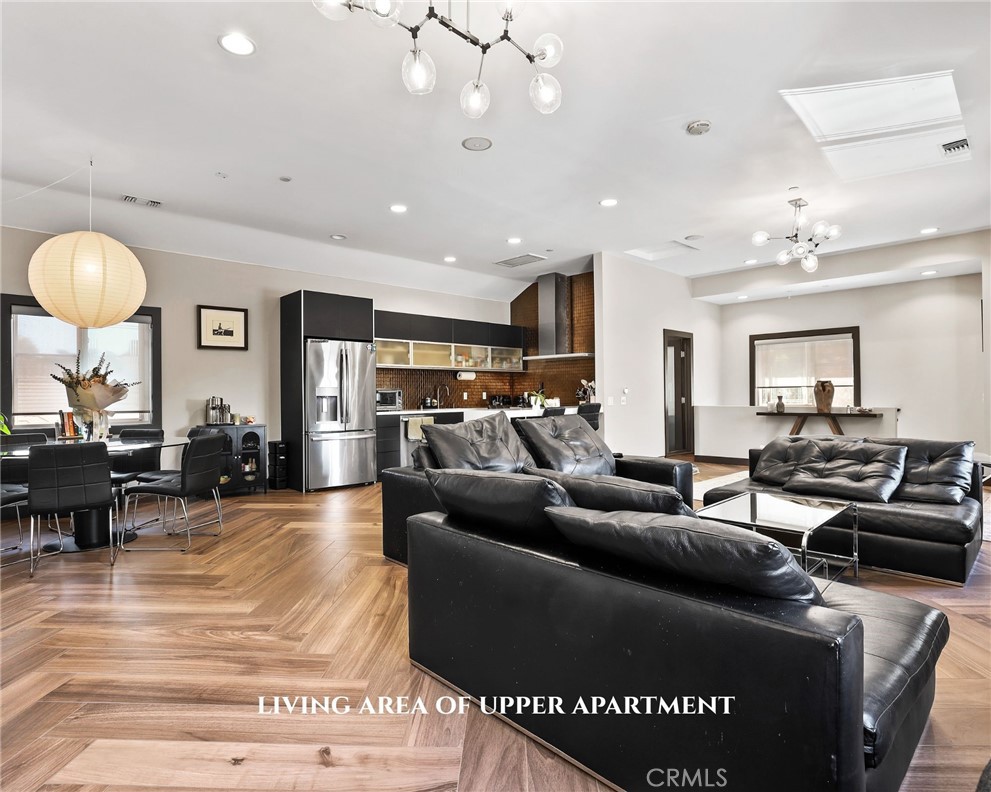 10372 South Crawford Canyon Road Santa Ana, CA 92705 - Photo 67 of 75 a living room with furniture and a large mirror