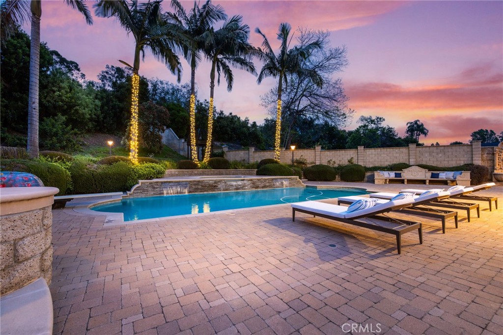 10372 South Crawford Canyon Road Santa Ana, CA 92705 - Photo 7 of 75 a park view with a bench and palm trees