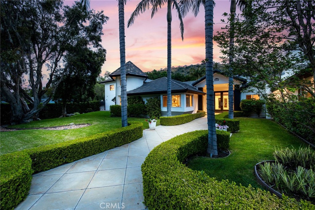 10372 South Crawford Canyon Road Santa Ana, CA 92705 - Photo 71 of 75 a front view of house with yard and green space