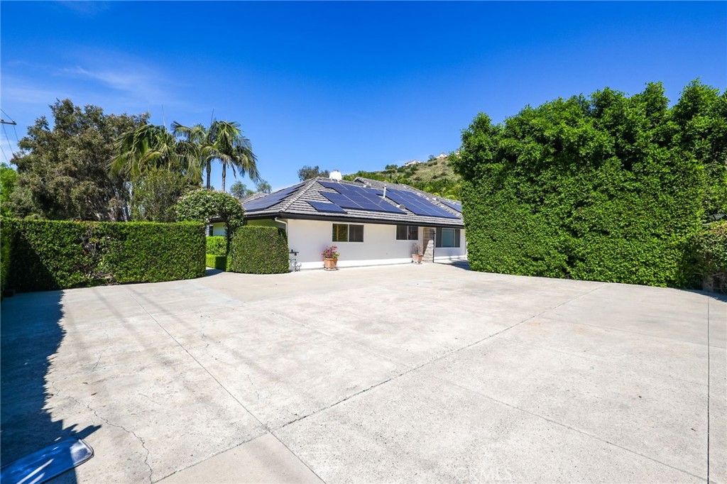 10372 South Crawford Canyon Road Santa Ana, CA 92705 - Photo 72 of 75 a front view of a house with a yard
