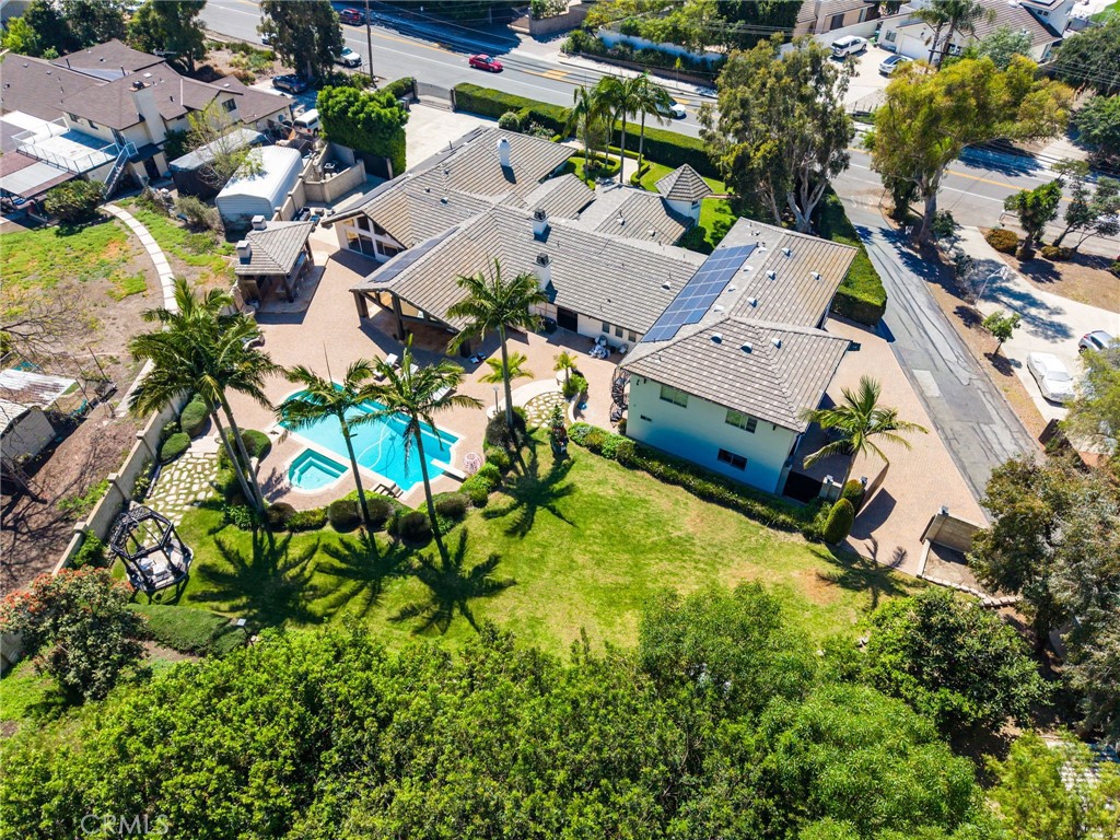 10372 South Crawford Canyon Road Santa Ana, CA 92705 - Photo 74 of 75 an aerial view of residential house with swimming pool and lawn chairs