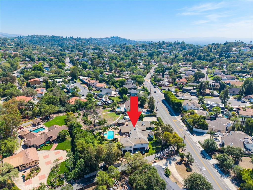 10372 South Crawford Canyon Road Santa Ana, CA 92705 - Photo 75 of 75 an aerial view of residential houses with outdoor space and trees