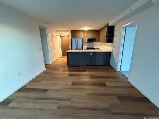a view of kitchen and kitchen with sink
