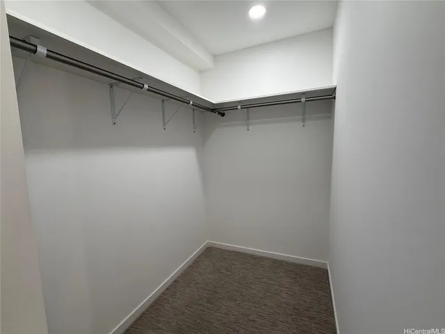 a view of a room with shelf on the wall