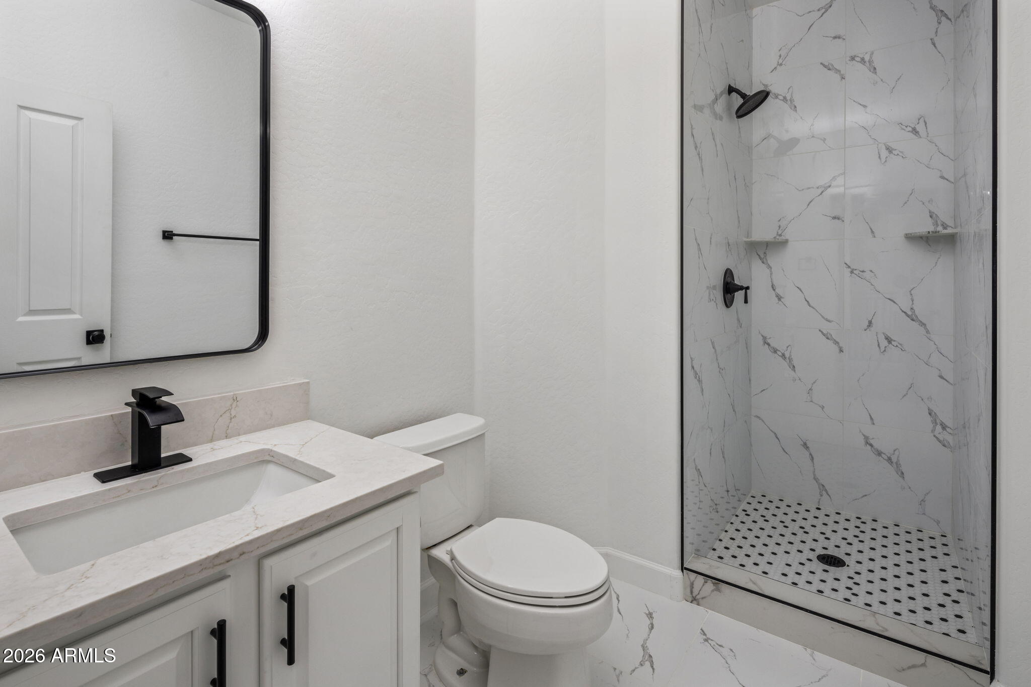 5121 West Beverly Road Laveen, AZ 85339 - Photo 28 of 32 a bathroom with a sink a toilet and shower