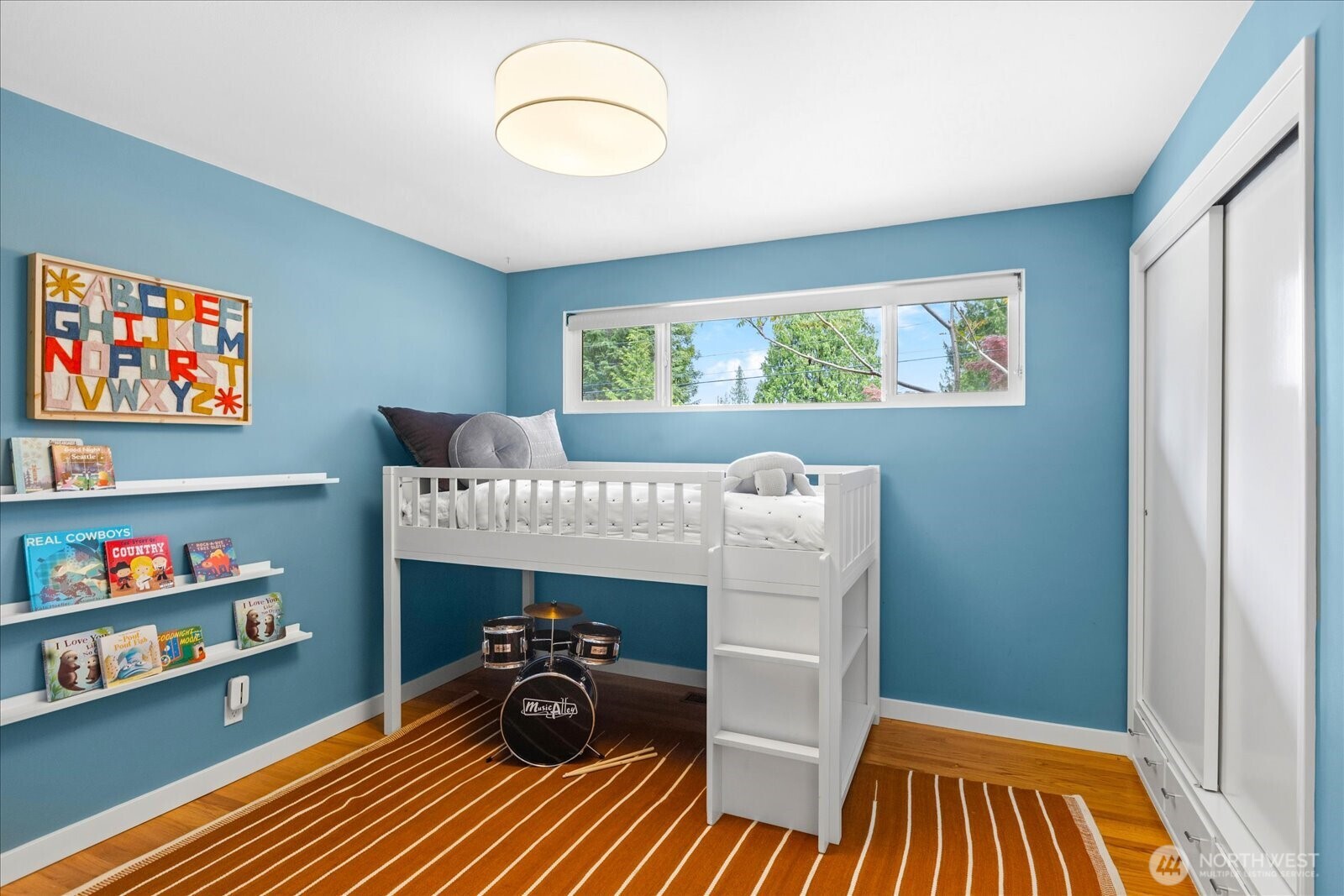 18722 84th Avenue West Edmonds, WA 98026 - Photo 22 of 40 a bedroom with a bed and a cabinets