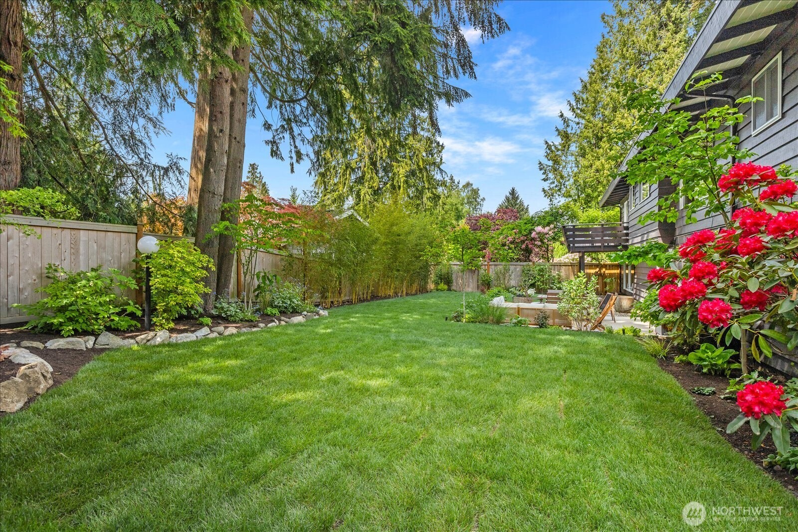 18722 84th Avenue West Edmonds, WA 98026 - Photo 3 of 40 a view of a garden with a fountain