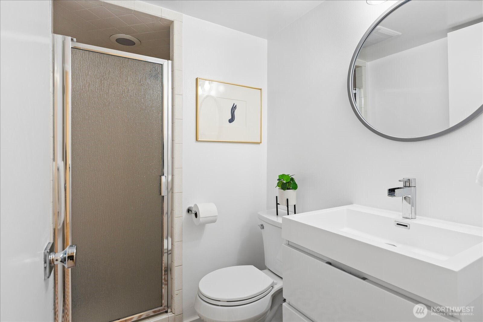 18722 84th Avenue West Edmonds, WA 98026 - Photo 31 of 40 a bathroom with a sink a toilet and a mirror