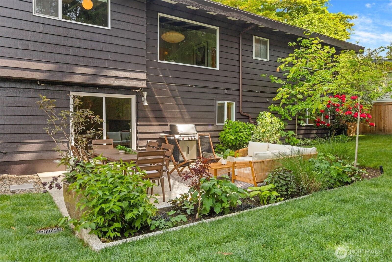 18722 84th Avenue West Edmonds, WA 98026 - Photo 34 of 40 a view of a chair and table in the garden front of house