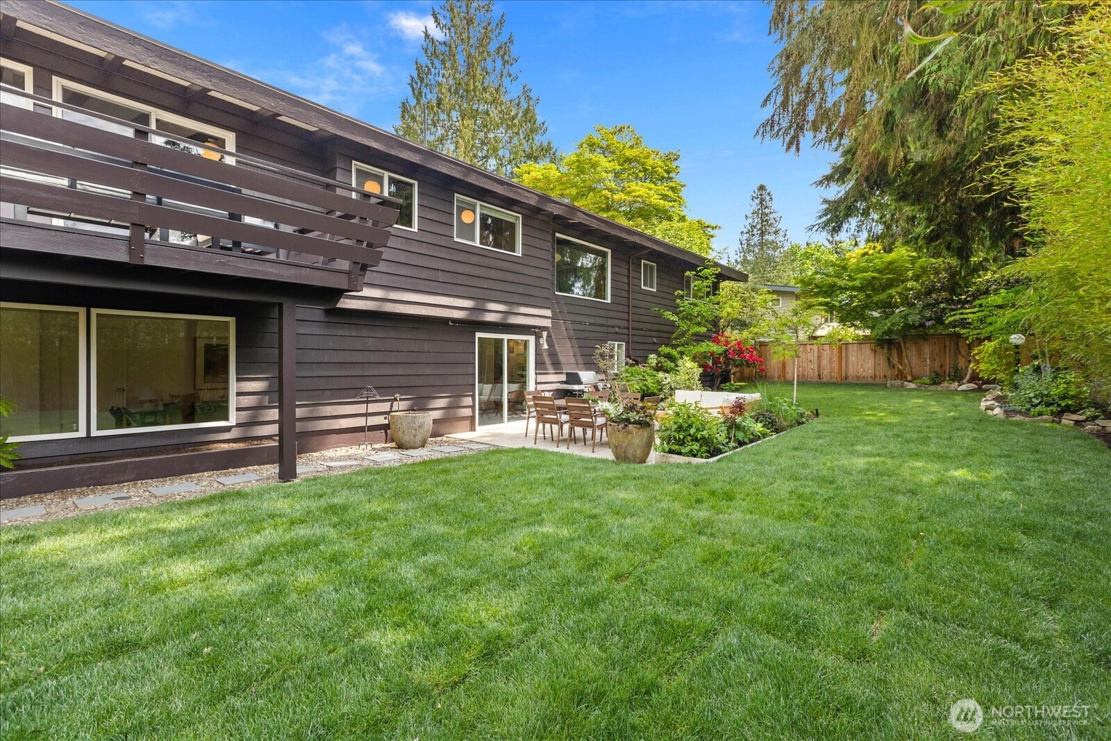 18722 84th Avenue West Edmonds, WA 98026 - Photo 35 of 40 a view of a house with backyard and porch