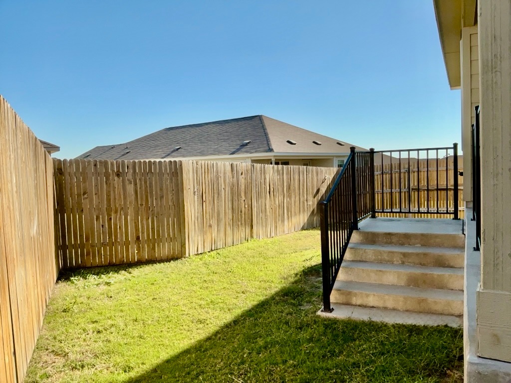 101 COSMOS Lane, Unit 32K Jarrell, TX 76537 - Photo 20 of 20 View of fenced backyard